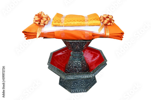 Kathin fabric, Kathin ceremony, Kathina robes to monks, in a carved tradition pearl tray with clipping path