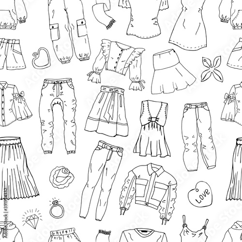 Seamless pattern from hand drawn fashionable clothes and accessories.  Set of doodles of clothes, bags and shoes. Fashion sketches. Jewelry collection. Casual style. Fashion doodles. Clothes sketches.