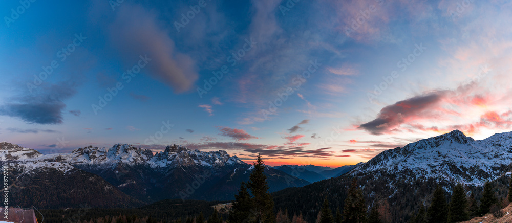 panoramic sunset views of the snowy peaks of the Italian Alps