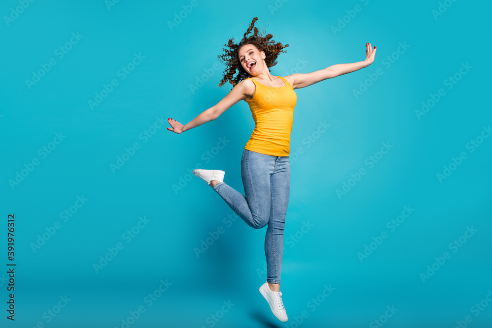 Full body photo overjoyed lady good mood jump high up rejoicing wear casual clothes isolated blue color background