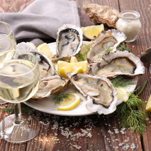 oyster and champaign on wood background