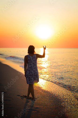 a glass of pure water in a gentle female hand