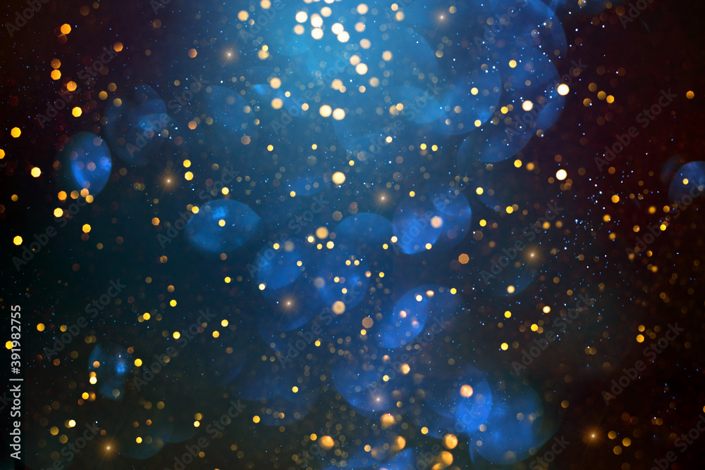 Golden abstract bokeh on dark blue background. Holiday concept Golden abstract bokeh on dark blue background. Holiday concept