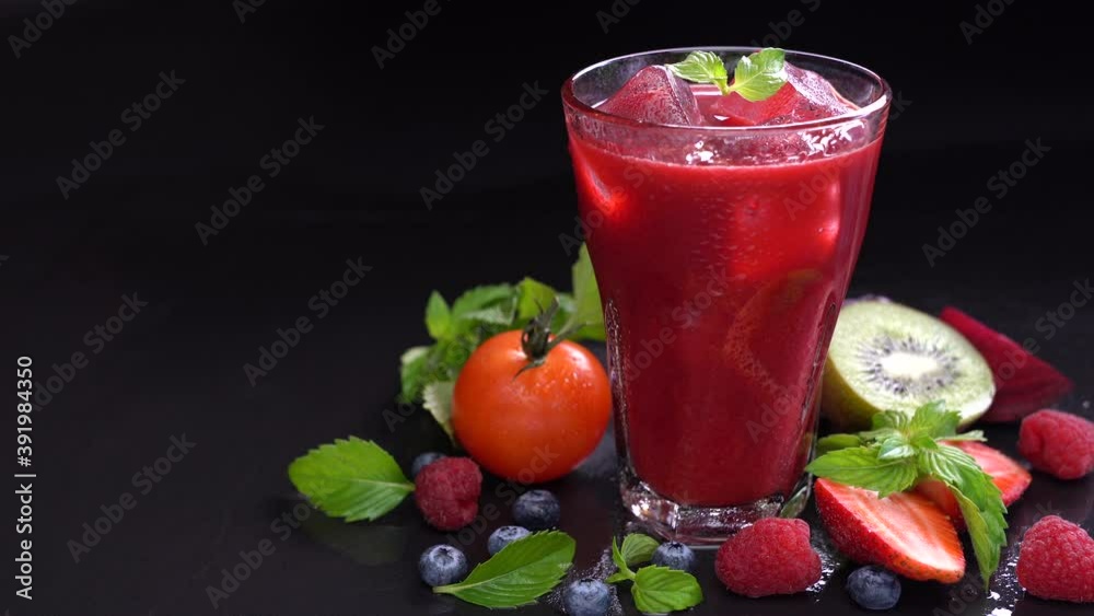 Mixed berry and beetroot juice with surrounding fruits Mixed berry and beetroot juice with surrounding fruits