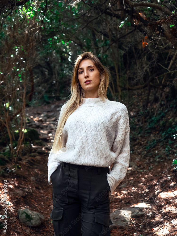 young woman walking in nature on an autumn day young woman walking in nature on an autumn day