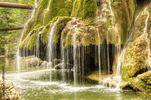 The unique Bigar waterfall full of green moss  Romania