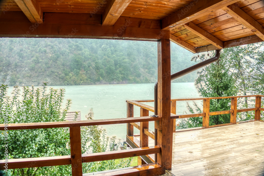 Heavy pouring rain over mountain lake Heavy pouring rain over mountain lake