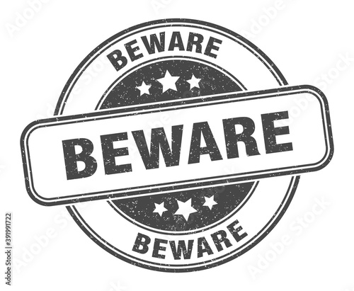 beware stamp. beware label. round grunge sign