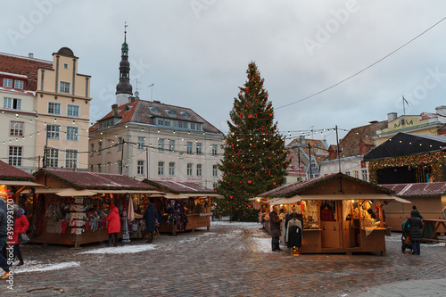 TALLINN, ESTONIA - DECEMBER 20, 2019: Snowy cityscape at time of traditional Christmas fair