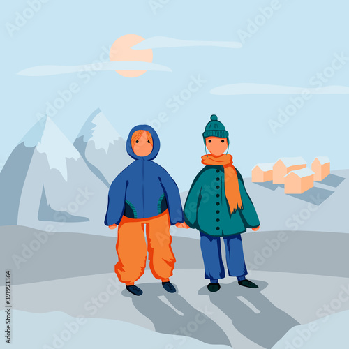 Happy warmly dressed children on vacation in winter mountains