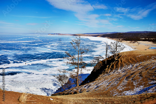 Lake Baikal on a Sunny winter day.  Beautiful view of the frozen Sarai Bay of Olkhon island.