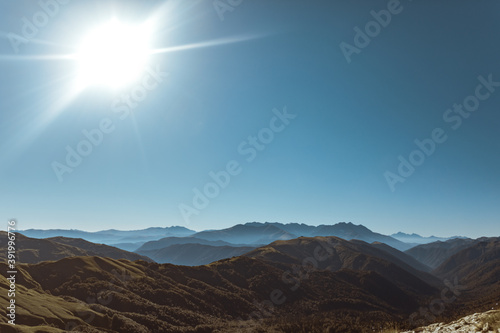 View of endless mountain ranges in the haze of the day