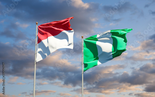 Beautiful national state flags of Monaco and Nigeria. © Leo Altman