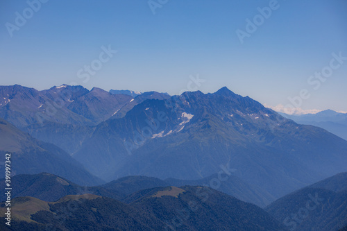 Fototapeta Naklejka Na Ścianę i Meble -  View of endless mountain ranges in the haze of the day
