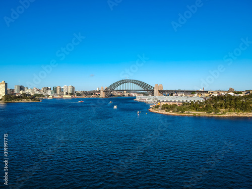 Panoramic Aerial views of Sydney Harbour with the bridge, CBD, North Sydney, Barangaroo, Lavender Bay and boats in view