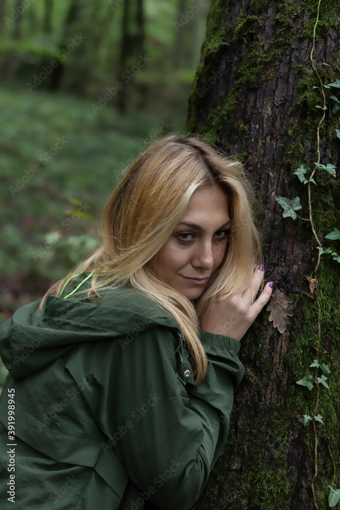 Beautiful woman alone in the forest in autumn Beautiful woman alone in the forest in autumn