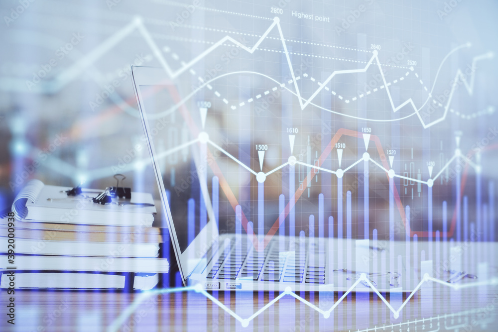 Forex Chart hologram on table with computer background. Multi exposure. Concept of financial markets. Forex Chart hologram on table with computer background. Multi exposure. Concept of financial markets.