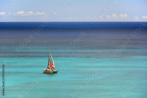 Sailing on a clear beautiful day off of Waikiki Beach on Oahu, Hawaii.  photo