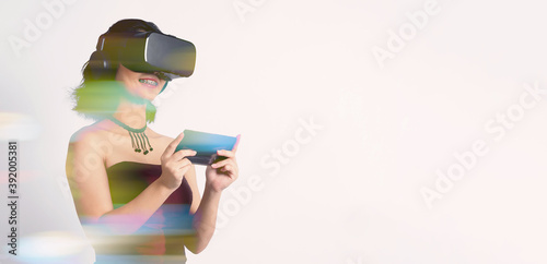 Asian teenage woman wearing VR or Virtual Reality head set and enter to the digital simulation world for learning and traveling or gaming and more. Studio shot white background.