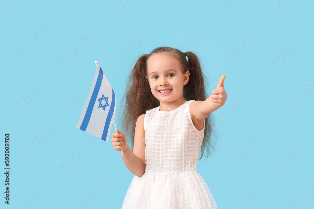 Little girl with the flag of Israel showing thumb-up on color background Little girl with the flag of Israel showing thumb-up on color background