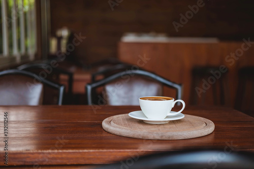 .Coffee cups on a wooden table in a coffee shop