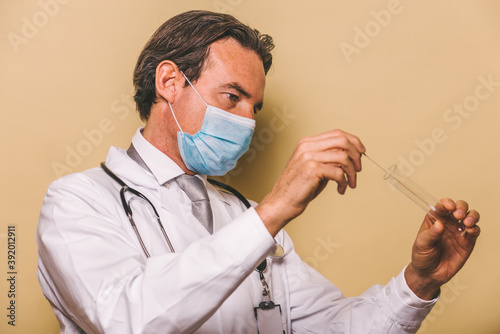 Doctor wearing protection suit and face mask for fighting Covid-19 ( Corona virus ) - Nurse portrait during coronavirus pandemic quarantine, concepts about healthcare and medical