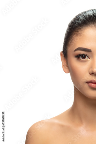 Well-kept. Portrait of beautiful young woman on white studio background. Concept of cosmetics, makeup, natural and eco treatment, skin care. Shiny and healthy look, fashion, healthcare. Copyspace.
