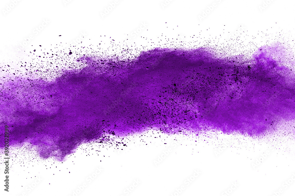 Freeze motion of purple color powder exploding on white background. Freeze motion of purple color powder exploding on white background.