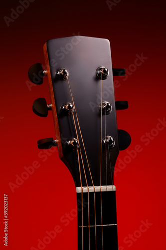 Acoustic guitar neck with strings close-up. Musical background for tutoring and learning to play the guitar. Mockup
