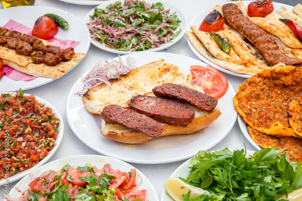 Turkish sausage also known as Sucuk. Grilled or barbecued Turkish sausage on the table in the Turkish restaurant. Turkish sausage also known as Sucuk. Grilled or barbecued Turkish sausage on the table in the Turkish restaurant.