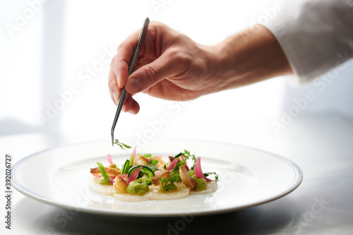 Wallpaper Mural Chef Preparing Dish In Kitchen.  Decorating Dish, Closeup Torontodigital.ca