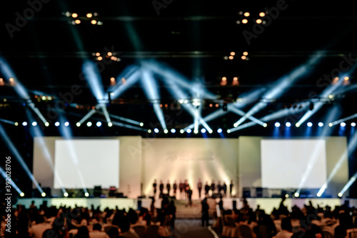 blurred background of event concert lighting at conference hall