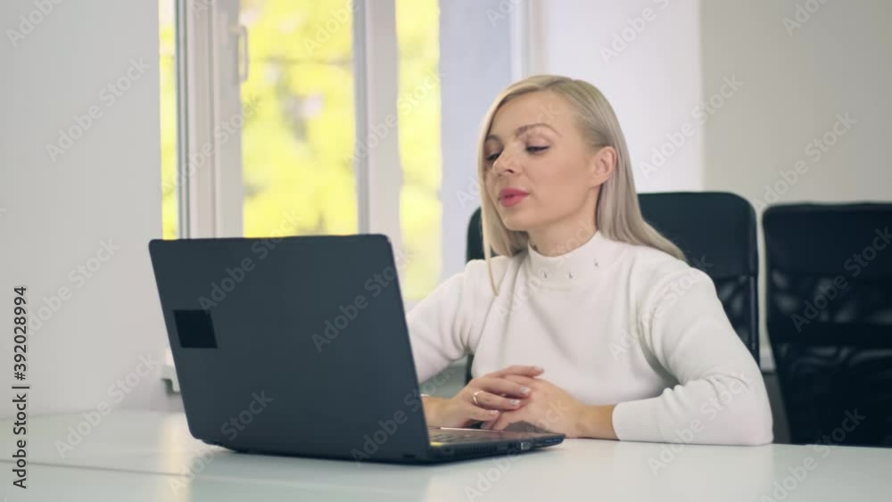 Millennial woman making video chat working from home using laptop. .Business woman talking on video communication using laptop. Online training or distance work. Millennial woman making video chat working from home using laptop. .Business woman talking on video communication using laptop. Online training or distance work.