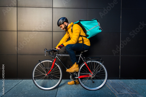 Food delivery, rider with bicycle delivering food photo