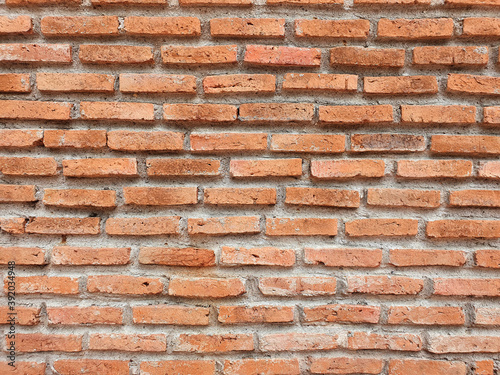 Old Red Brick wall is a block texture background for design and decoration.