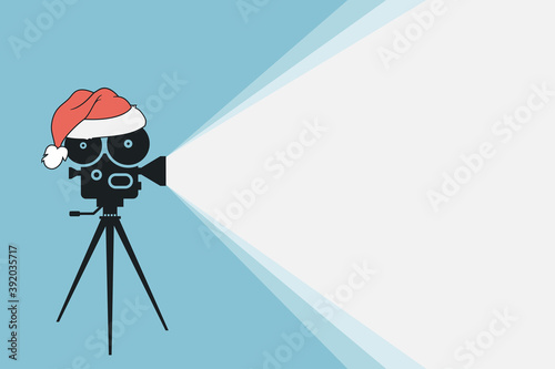 Vintage movie projector with Santa Claus hat. Cinema movie festival poster. Cinema background. Film camera projecting a beam of light with place for text. Design film frame for ticket, brochure,banner