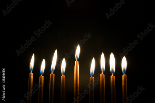 Close-up of Burning Golden Hanukah Candles photo