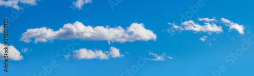 Blue sky with white cumulus clouds, sky panorama