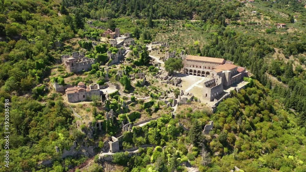 Aerial drone video of medieval byzantine old city of Mystras featuring Monastery of Pantanassa, Temple of Agia Sofia and uphill castle of Mystras, Sparta, Peloponnese, Greece Aerial drone video of medieval byzantine old city of Mystras featuring Monastery of Pantanassa, Temple of Agia Sofia and uphill castle of Mystras, Sparta, Peloponnese, Greece