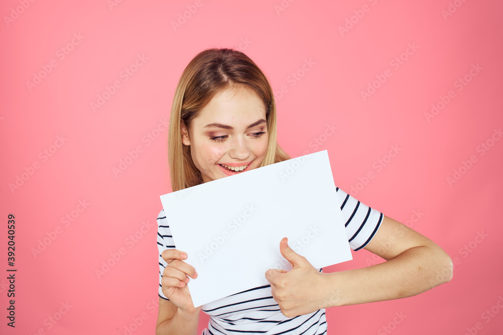 woman holding white sheet in her hands striped t-shirt emotions pink background woman holding white sheet in her hands striped t-shirt emotions pink background