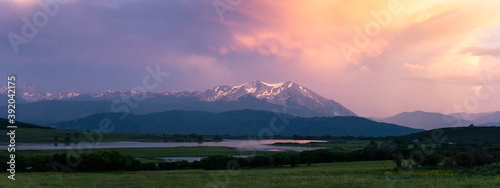 Panoramic shot of landscape against cloudy sky during sunset