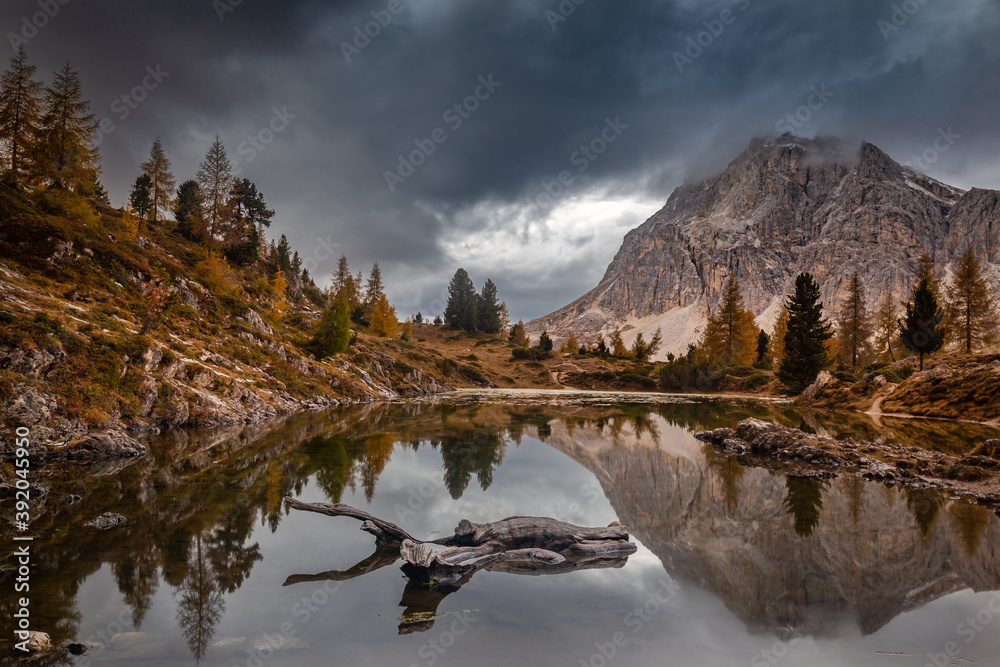 Obraz premium Moody Skies With Lake Reflections In The Dolomites