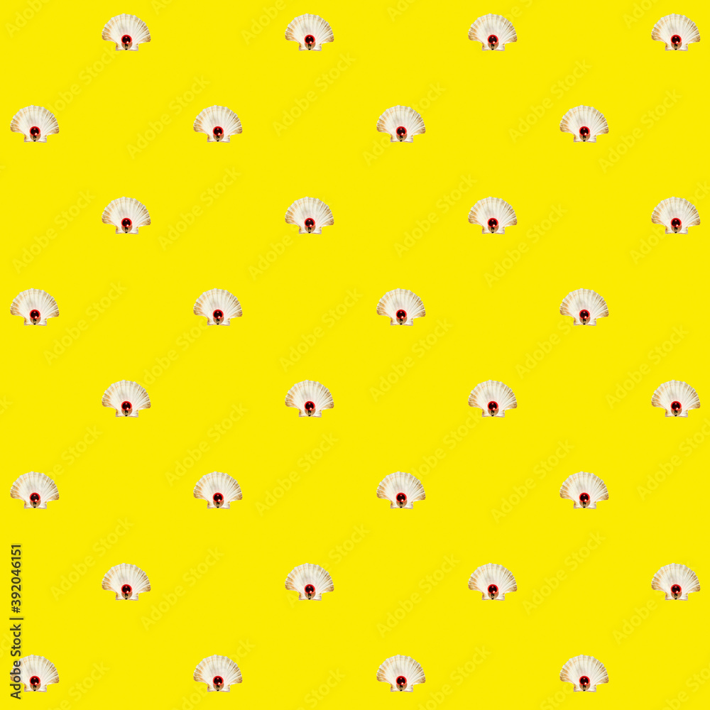 White seashell and small red ball over yellow backdrop. Abstract colorful isometric pattern. White seashell and small red ball over yellow backdrop. Abstract colorful isometric pattern.