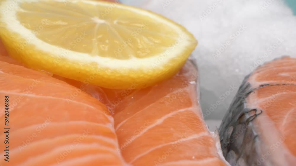extreme close-up, detailed. salmon steak on ice. blue background. extreme close-up, detailed. salmon steak on ice. blue background.