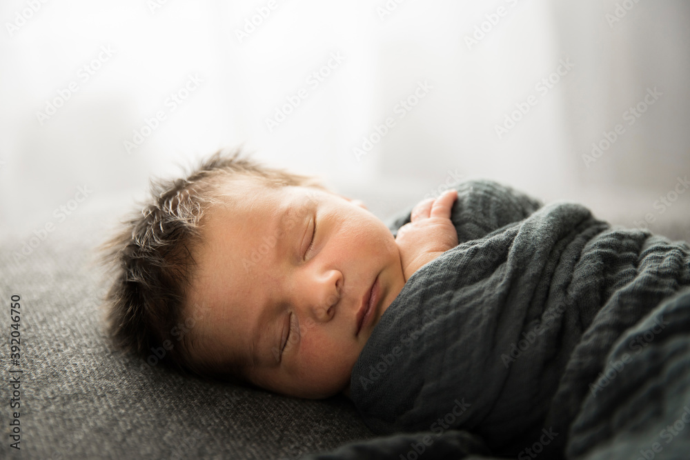 Backlit Sleeping Newborn With Lots of Hair Faces Camera Backlit Sleeping Newborn With Lots of Hair Faces Camera
