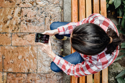 Handsome man taking a selfie outdoors with a cenital view photo