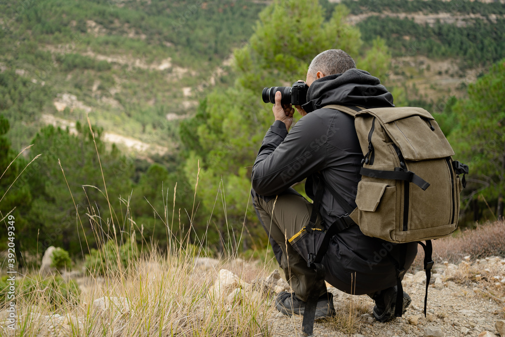 caucasian man Traveler with photo camera and backpack caucasian man Traveler with photo camera and backpack
