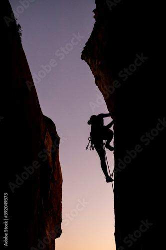 Wallpaper Mural Beautiful view to silhouette of man climbing during sunset Torontodigital.ca