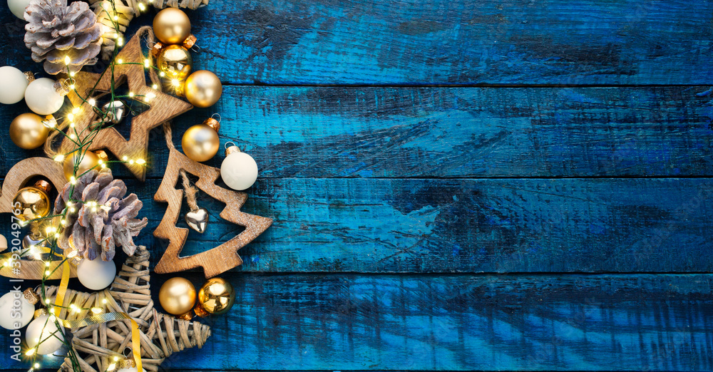 A Christmas wooden natural decoration ornament; wide horizontal banner background with copyspace A Christmas wooden natural decoration ornament; wide horizontal banner background with copyspace