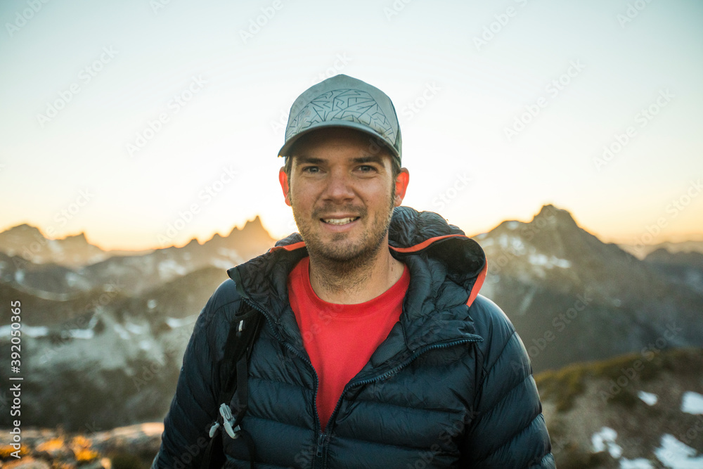 Portrait of back lit man standing at sunset in mountains. Portrait of back lit man standing at sunset in mountains.